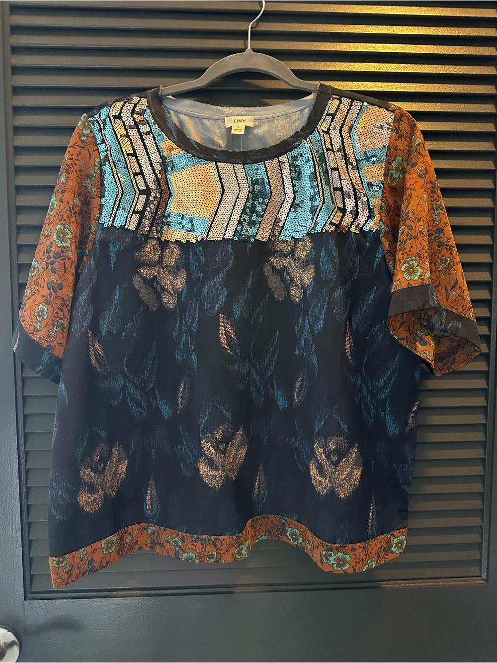 Anthropologie (TINY Brand) 
Black, Teal & Rust Mixed-Print Sequin Yoke Blouse